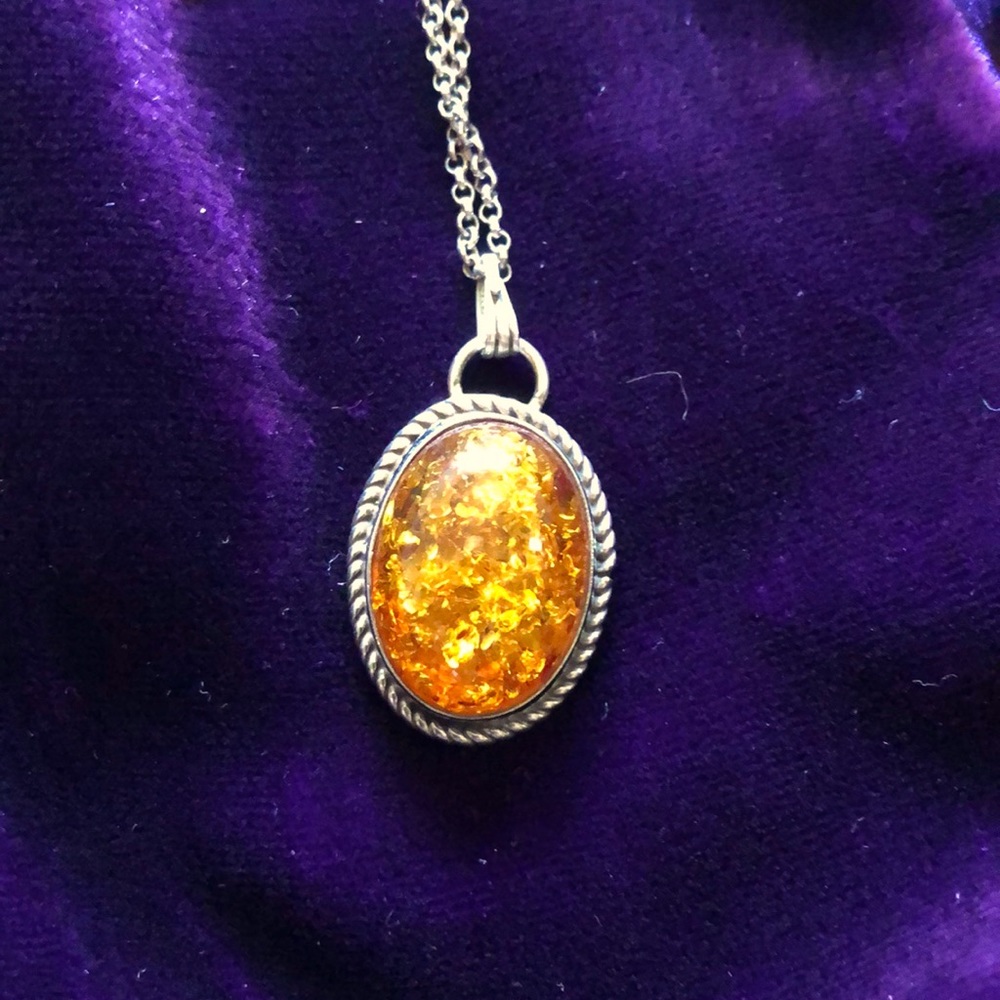 Genuine Amber and sterling silver pendant w/chain.